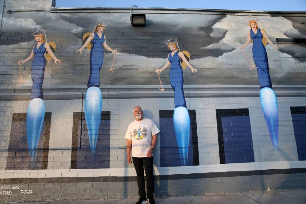 James Stanford with part of his mural, "A Phalanx of Angels Ascending" on the 705 Building at 7 ...