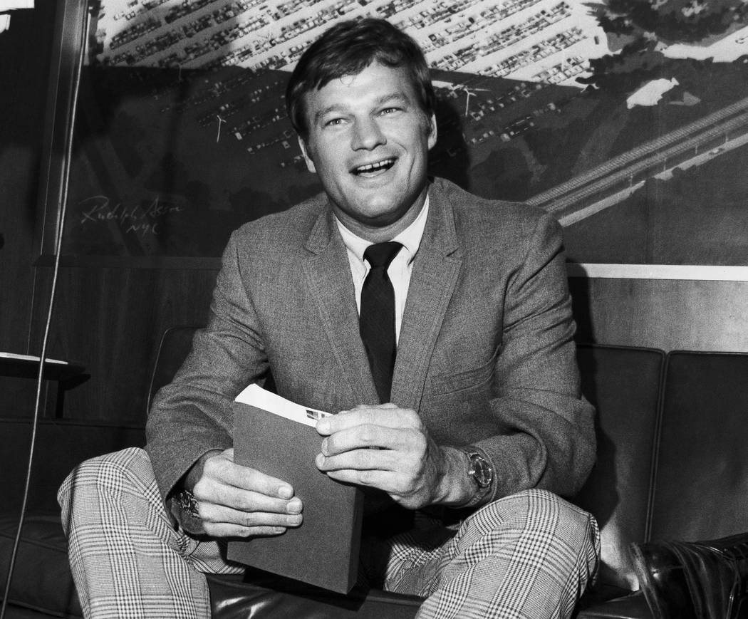 FILE - In this Aug. 11, 1970 file photo, New York Yankees pitcher Jim Bouton, holds a copy of h ...