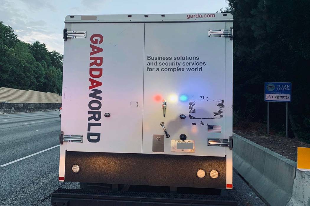 An armored truck is parked on the shoulder of I-285 in Atlanta on July 9, 2019, after the side ...