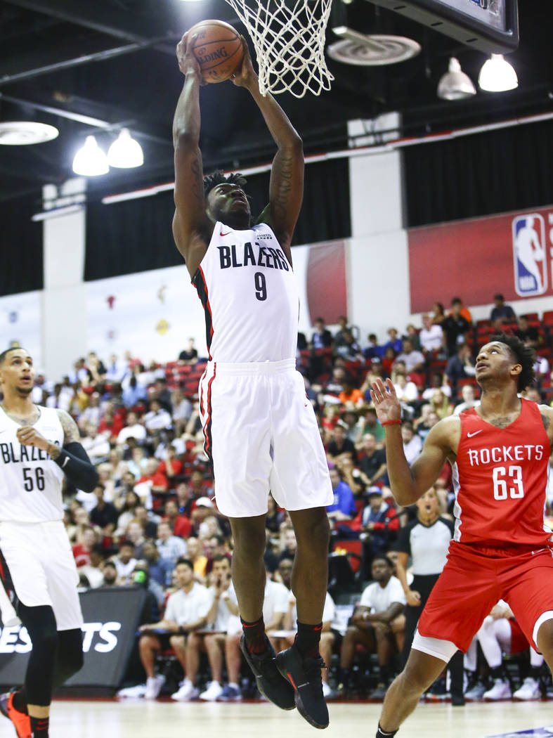 Portland Trail Blazers' Nassir Little (9) goes to the basket against the Houston Rockets during ...