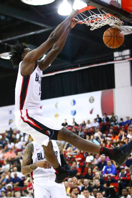 Portland Trail Blazers' Nassir Little (9) dunks against the Houston Rockets during the first ha ...