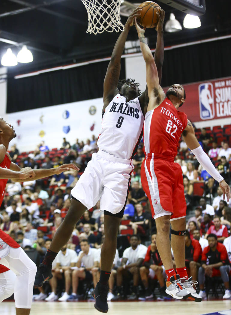 Portland Trail Blazers' Nassir Little (9) battles for a rebound against Houston Rockets' Isaiah ...