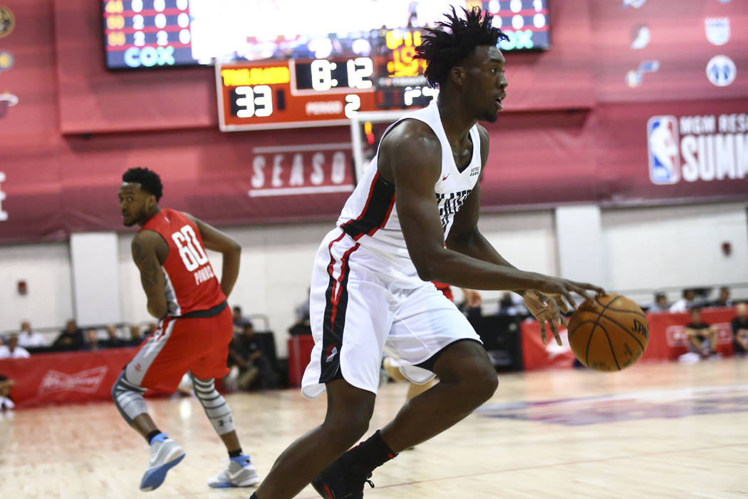 Portland Trail Blazers' Nassir Little (9) drives to the basket against the Houston Rockets duri ...