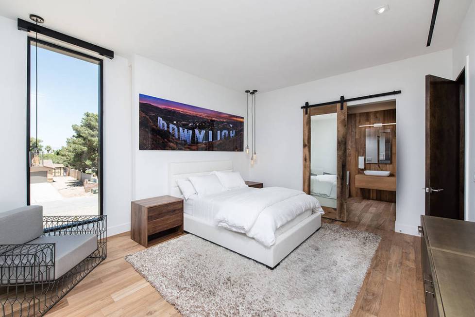 One of the secondary bedrooms features photographer Peter Lik's work. (Jewel Homes)