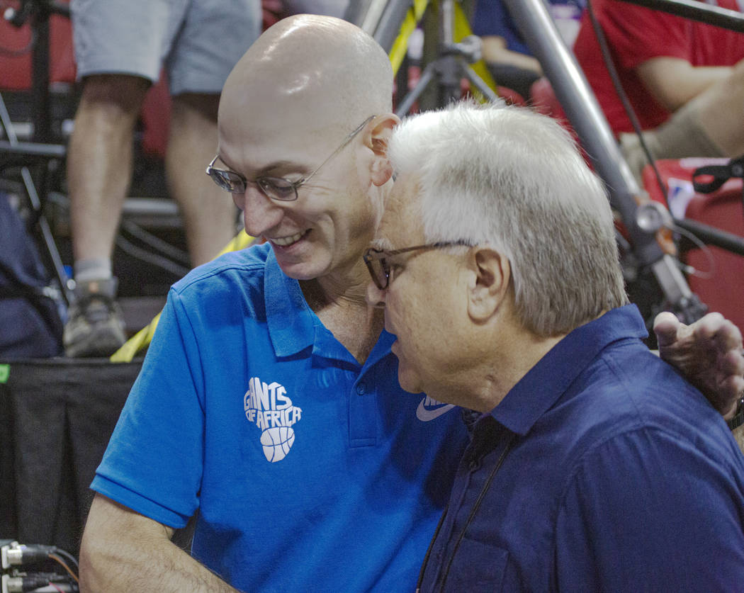 NBA Commissioner Adam Silver talks to Summer League Executive director Warren LeGarie during th ...