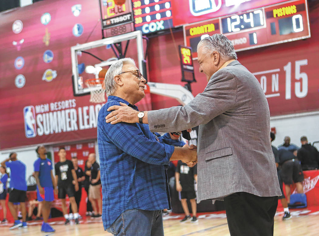 Warren LeGarie, executive director of the Vegas Summer League, left, talks with Gov. Steve Siso ...