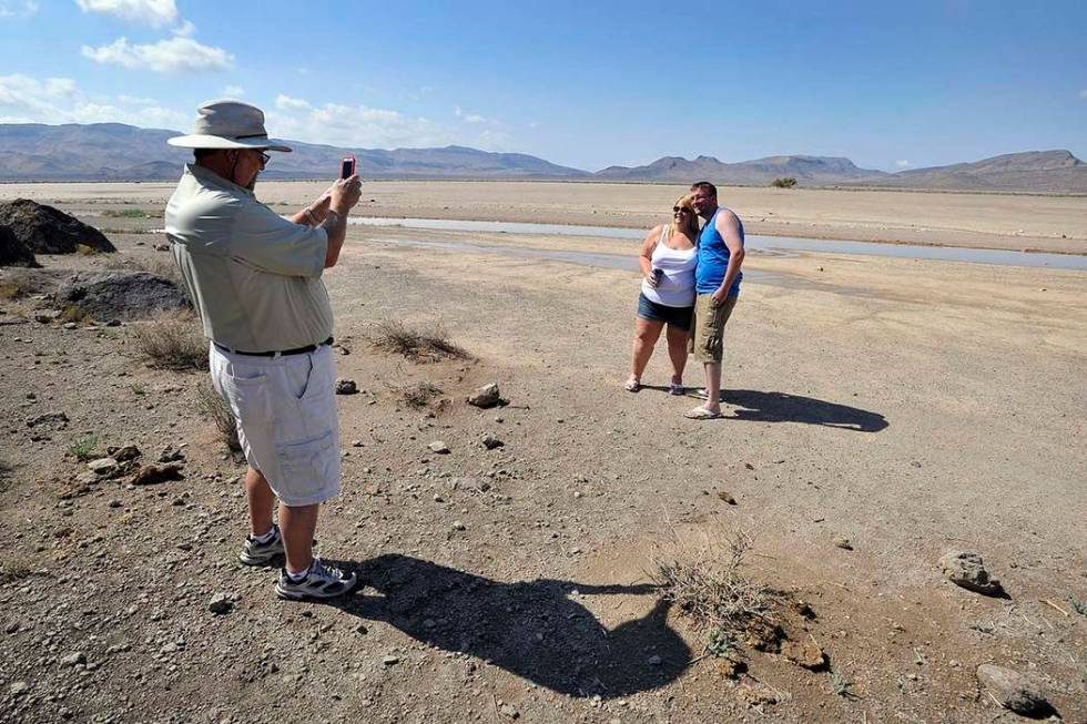 Dean Baumgartner, left, of Adventure Photo Tours, photographs Becky Cooper and Shane Cooper of ...