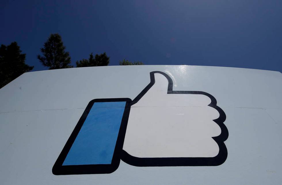 An April 25, 2019, file photo shows the thumbs-up "Like" logo on a sign at Facebook headquarter ...