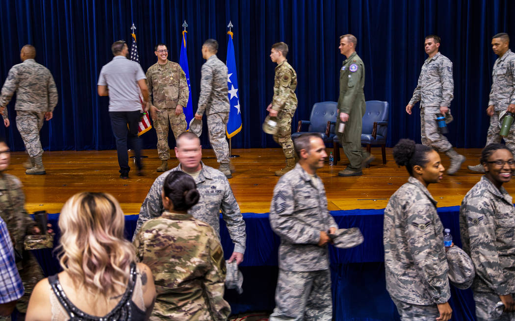 Staff Sgt. Kenneth DeLongchamp, top left, is congratulated by others at Nellis Air Force Base o ...