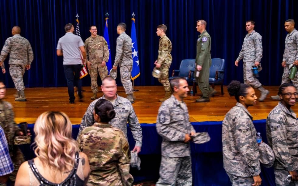 Staff Sgt. Kenneth DeLongchamp, top left, is congratulated by others at Nellis Air Force Base o ...