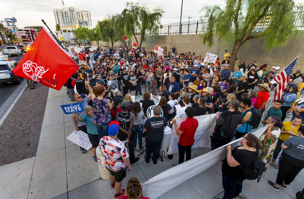 Advocates, activists and impacted persons gather for protest chants during Lights for Liberty: ...