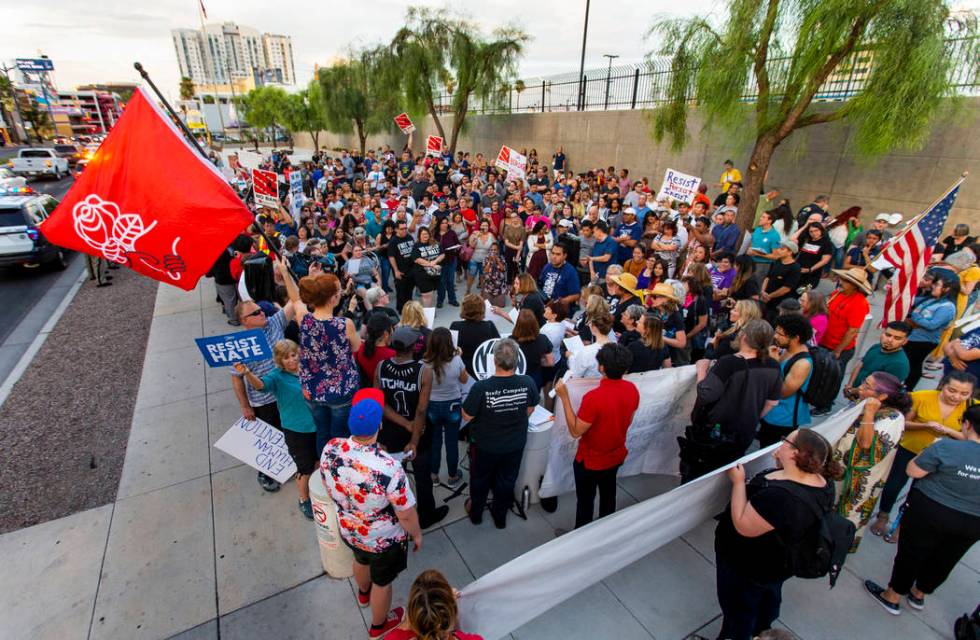 Advocates, activists and impacted persons gather for protest chants during Lights for Liberty: ...