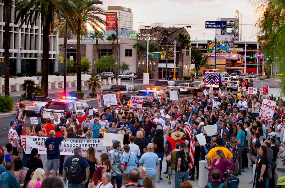 Advocates, activists and impacted persons gather for protest chants during Lights for Liberty: ...