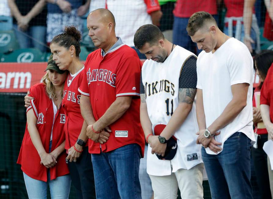 Members of Tyler Skaggs' family, including wife, Carli, left; mother, Debbie, second from left; ...