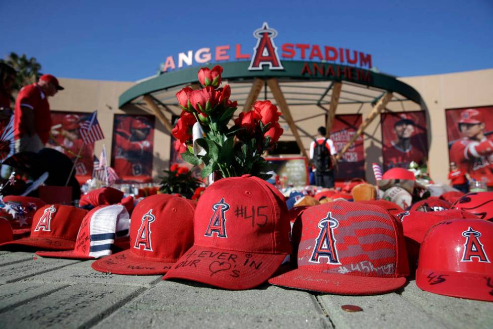 A makeshift shrine in honor of Los Angeles Angels pitcher Tyler Skaggs stands outside Angel Sta ...
