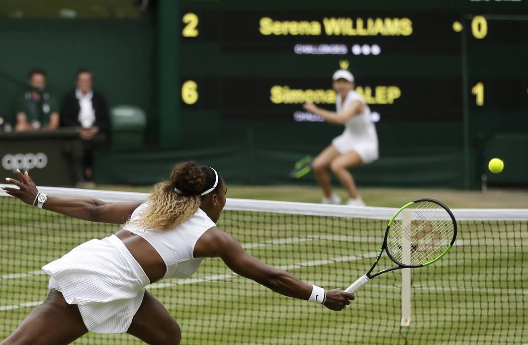 United States' Serena Williams returns the ball to Romania's Simona Halep, background, during t ...