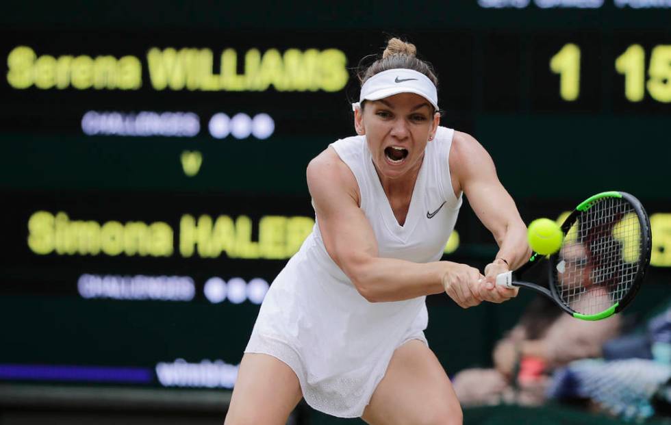 Romania's Simona Halep returns the ball to United States' Serena Williams during the women's si ...