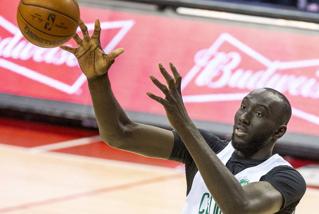 Boston Celtics center Tacko Fall looks in a rebound over the Memphis Grizzlies during the secon ...