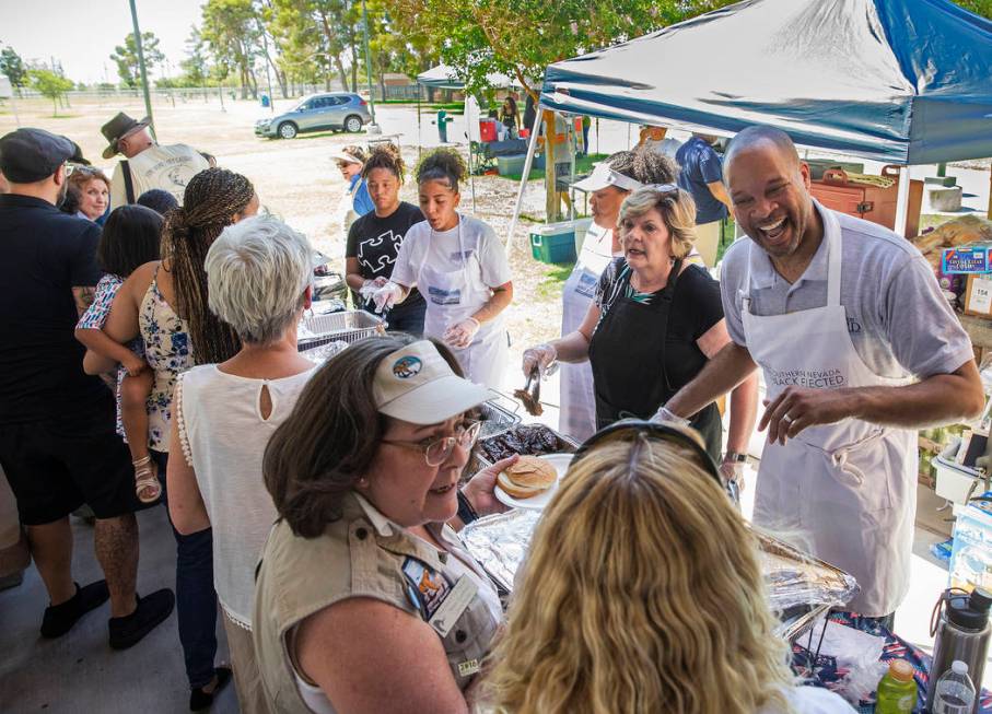 Nevada Attorney General Aaron Ford, top/right, greets guests during the 5th Annual Community BB ...