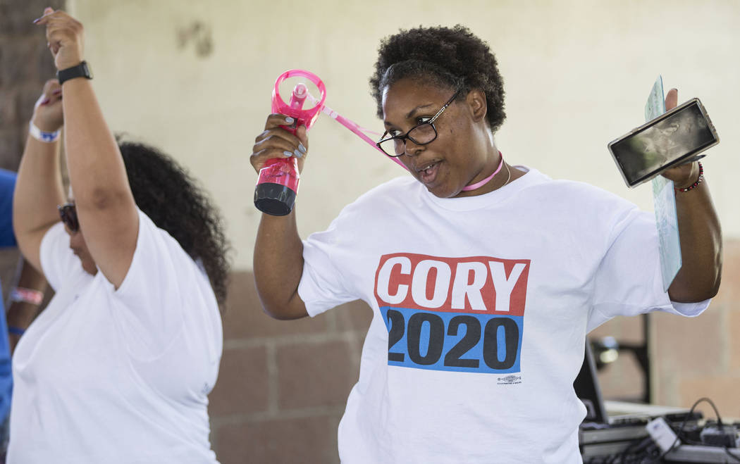 ShaRhonda Ramos, right, an organizer for democratic presidential candidate Sen. Cory Booker, D- ...