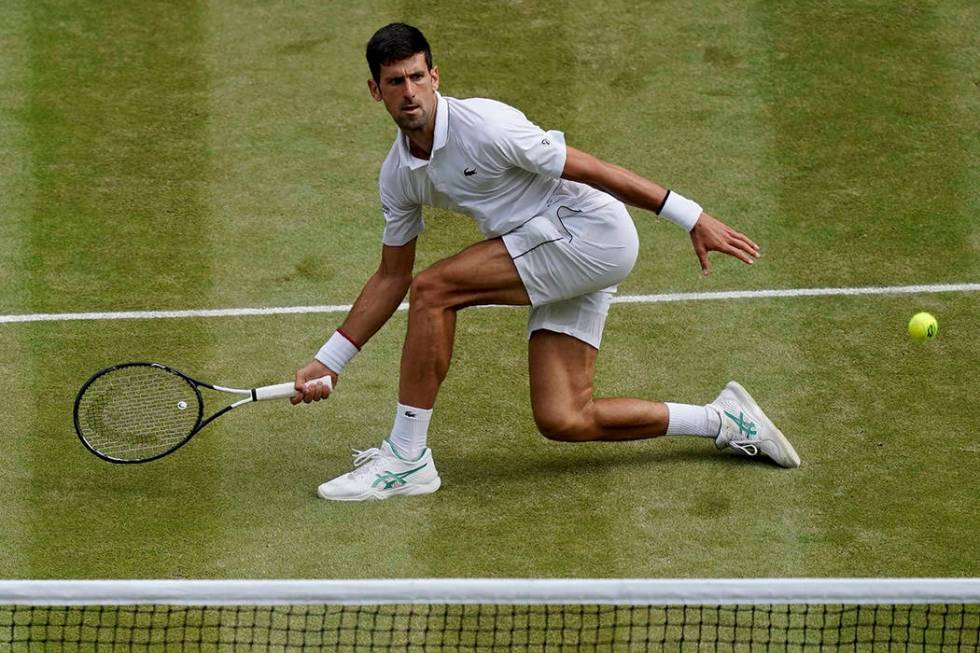 Serbia's Novak Djokovic plays a return to Switzerland's Roger Federer during the men's singles ...