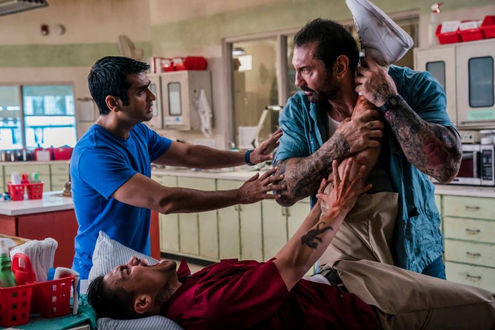 This image released by 20th Century Fox shows Dave Bautista, right, and Kumail Nanjiani, standi ...