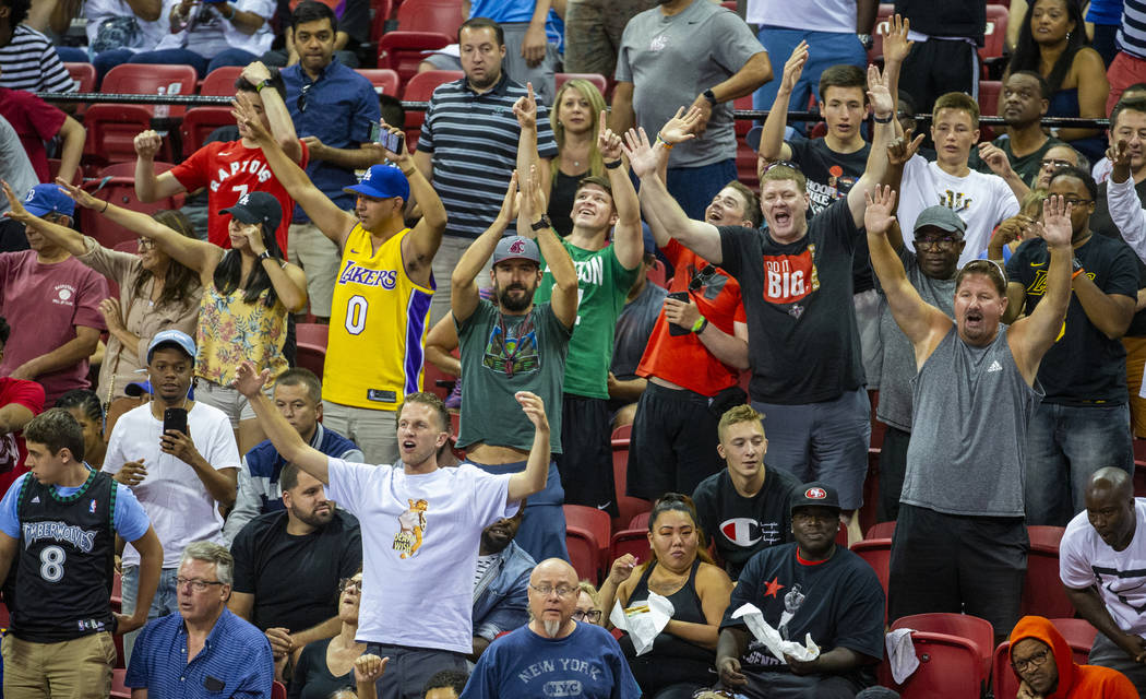 Fans yells for their teams and free merchandise as the Memphis Grizzlies play the New Orleans P ...