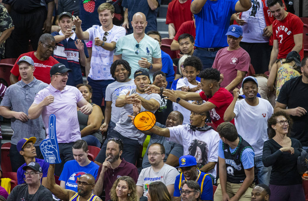 Fans yells for their teams and free merchandise as the Memphis Grizzlies play the New Orleans P ...