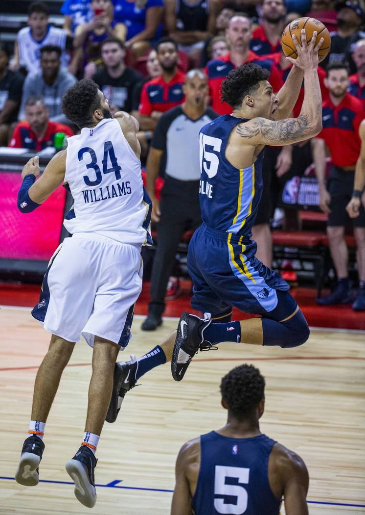 Memphis Grizzlies forward Brandon Clarke, right, soars to the basket for a late score over New ...