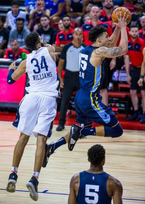 Memphis Grizzlies forward Brandon Clarke, right, soars to the basket for a late score over New ...