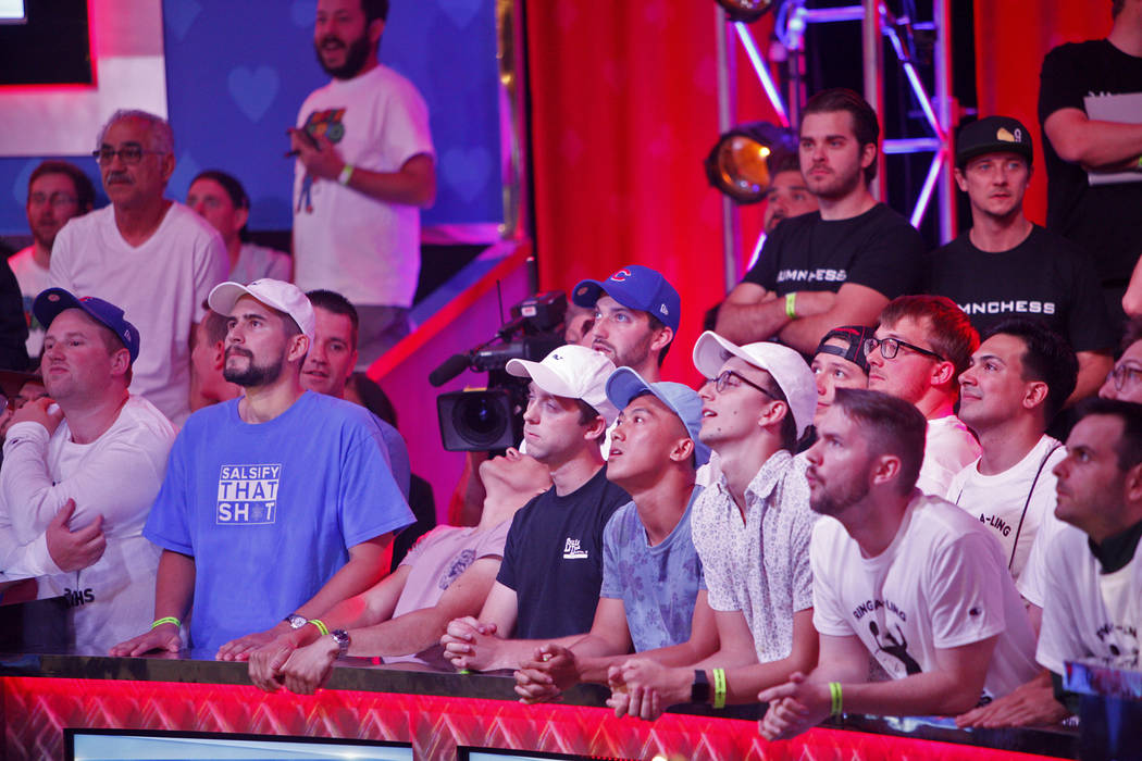 Fans watch the main event final table during the World Series of Poker at the Rio hotel-casino ...