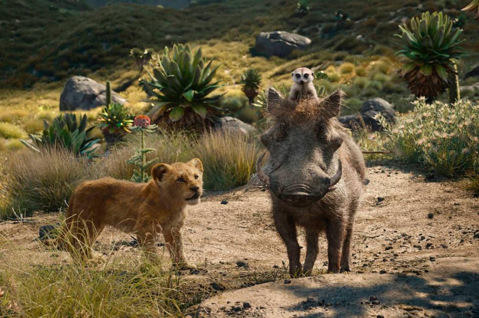 This image released by Disney shows, from left, young Simba, voiced by JD McCrary, Timon, voice ...