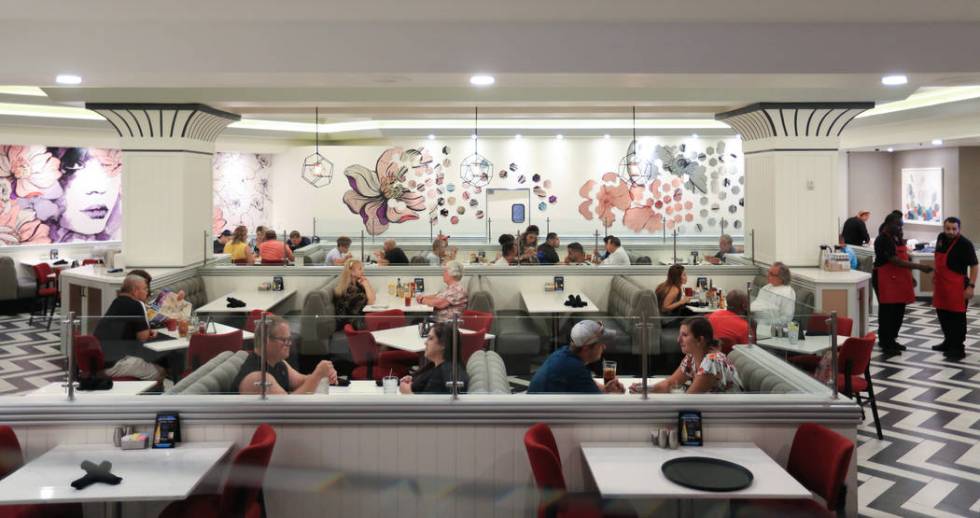 Diners enjoy a meal at the STRAT Cafe, a new eatery opened as part of renovations to The STRAT ...