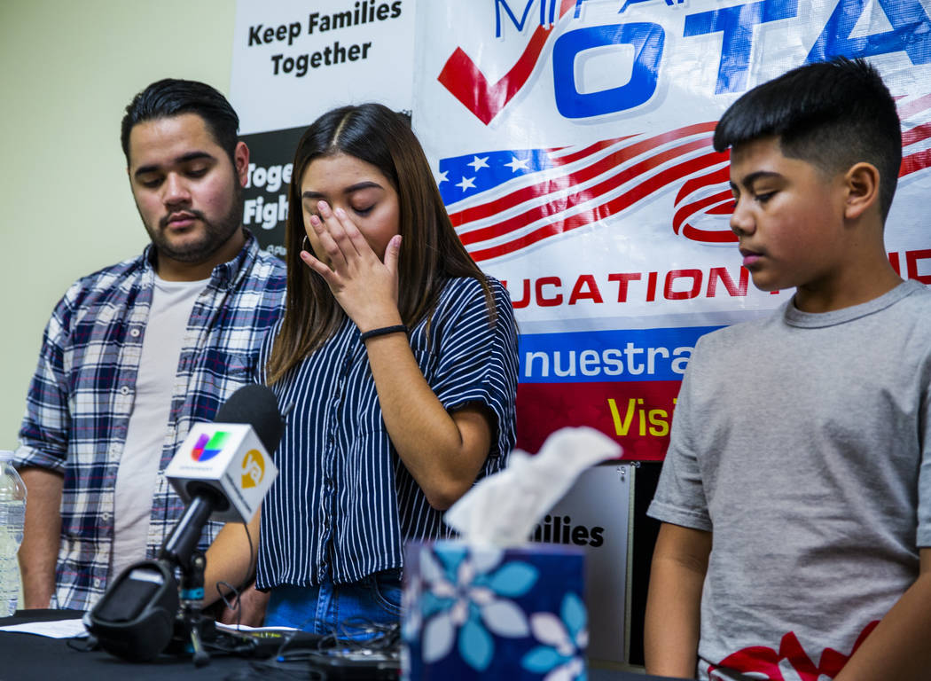 Kimberly Arellano Cruz, 16, center, becomes emotional beside her brothers Omar Arellano Cruz, 2 ...