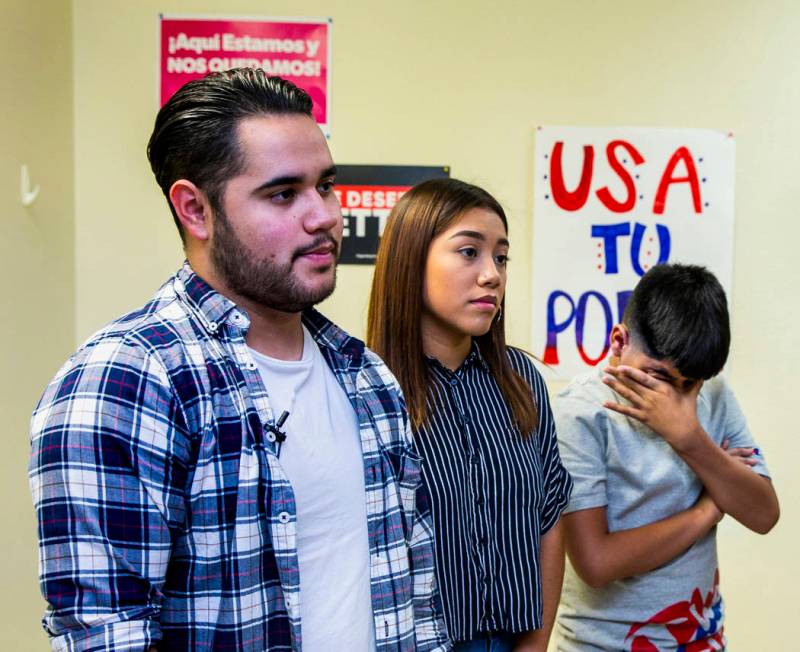 Omar Arellano Cruz, 21, left, Kimberly Arellano Cruz, 16, and AJ Arellano Cruz,12, listen to a ...