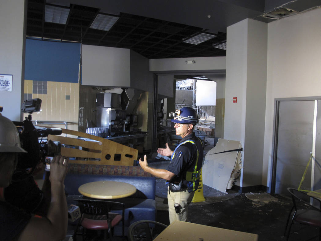 University of Nevada, Reno Police Chief Todd Renwick describes the damage inside a school dormi ...