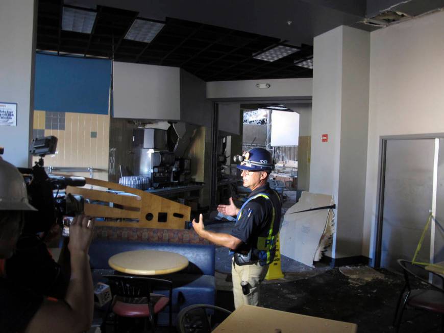 University of Nevada, Reno Police Chief Todd Renwick describes the damage inside a school dormi ...