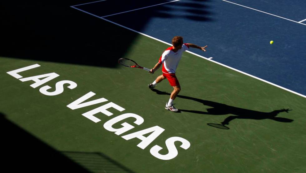 Dudi Sela, of Israel, hits a return to Fernando Gonzalez, of Chile, during the first round of t ...