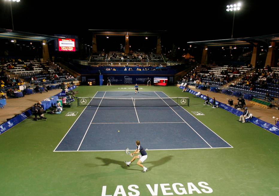 Julien Benneteau, of France, hits a return versus Lleyton Hewitt, of Australia, during the seco ...