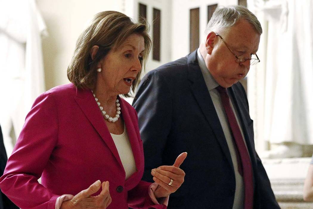 House Speaker Nancy Pelosi of California walks out of the House Chamber, Tuesday, July 16, 2019 ...