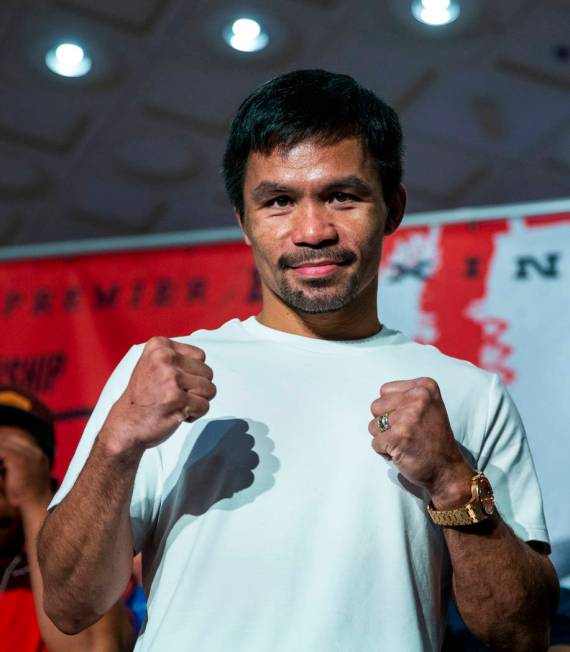 Boxer Manny Pacquiao poses for the crowd during his grand arrival to the MGM Grand on Tuesday, ...