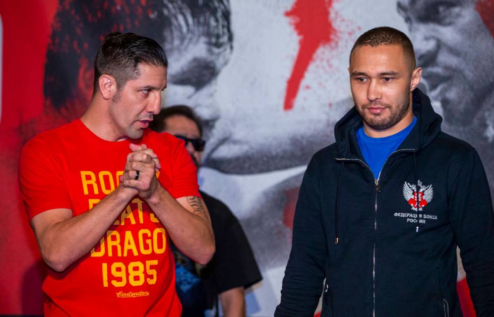 Boxer John Molina Jr., left, looks to opponent Sergey Lipinets during fighter grand arrivals at ...