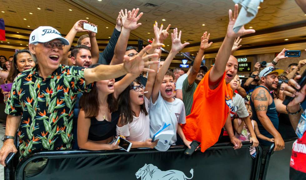 Fans go crazy as they scream for their favorite fighters during fighter grand arrivals at the M ...