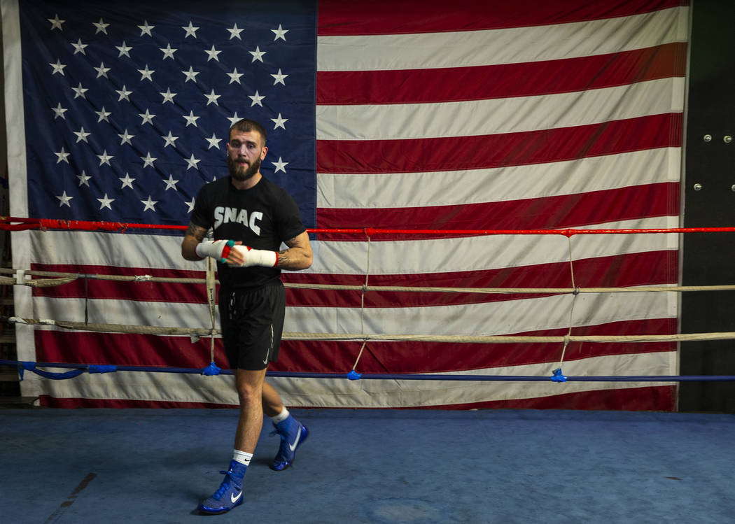 Boxer Caleb Plant, IBF super middleweight champion, warms up in the ring during a media day/ope ...