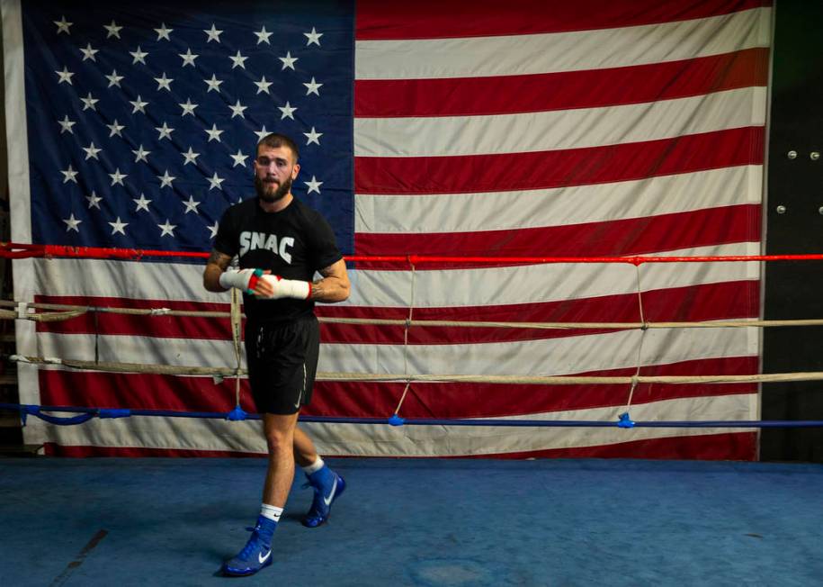 Boxer Caleb Plant, IBF super middleweight champion, warms up in the ring during a media day/ope ...