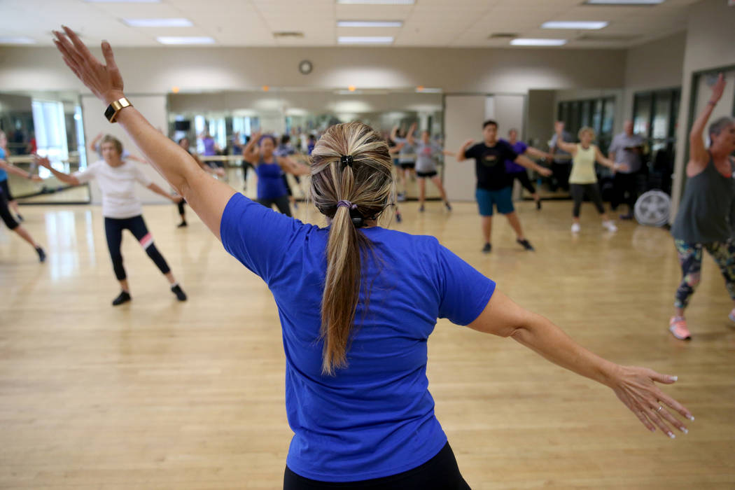 Anita Stephens leads a STRONG by Zumba class as part of the SilverSneakers fitness program at D ...