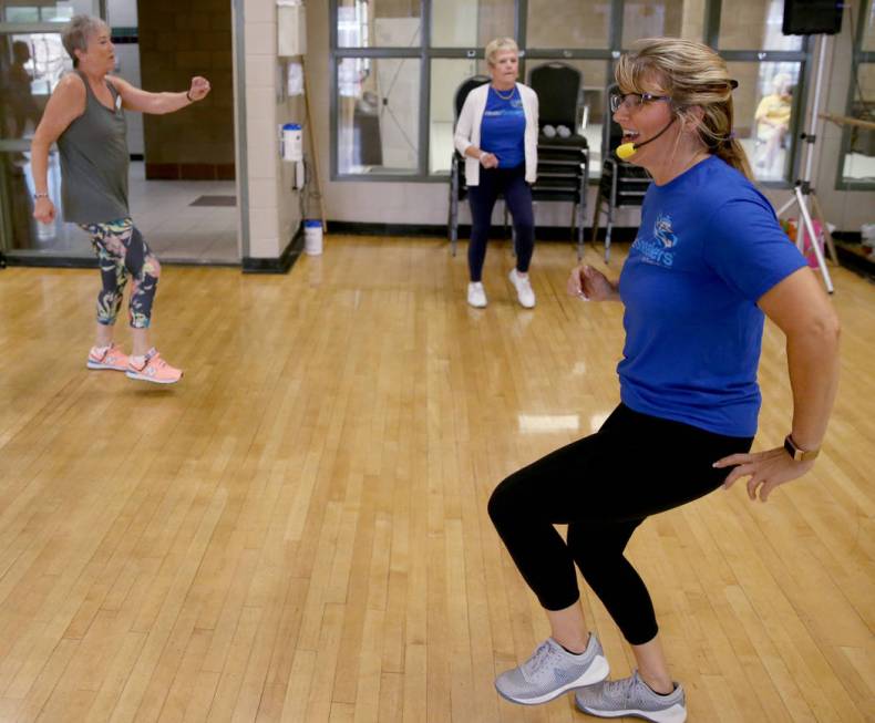 Anita Stephens leads a STRONG by Zumba class as part of the SilverSneakers fitness program at D ...