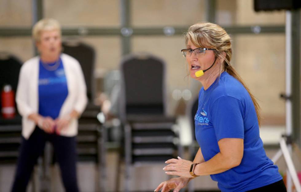 Anita Stephens leads a STRONG by Zumba class as part of the SilverSneakers fitness program at D ...