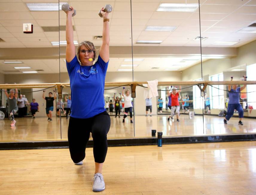 Anita Stephens leads a STRONG by Zumba class as part of the SilverSneakers fitness program at D ...