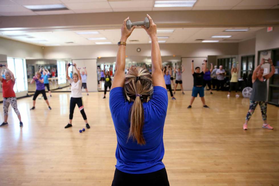 Anita Stephens leads a STRONG by Zumba class as part of the SilverSneakers fitness program at D ...